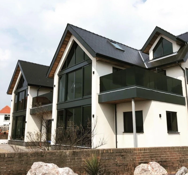 glass-balcony-glass-juliet-balcony-grey-apex-house-swansea-swansea-glass-balustrades Glass balcony balustrade showing glass juliet balcony grey apex house in Swansea by Swansea Glass Balustrades